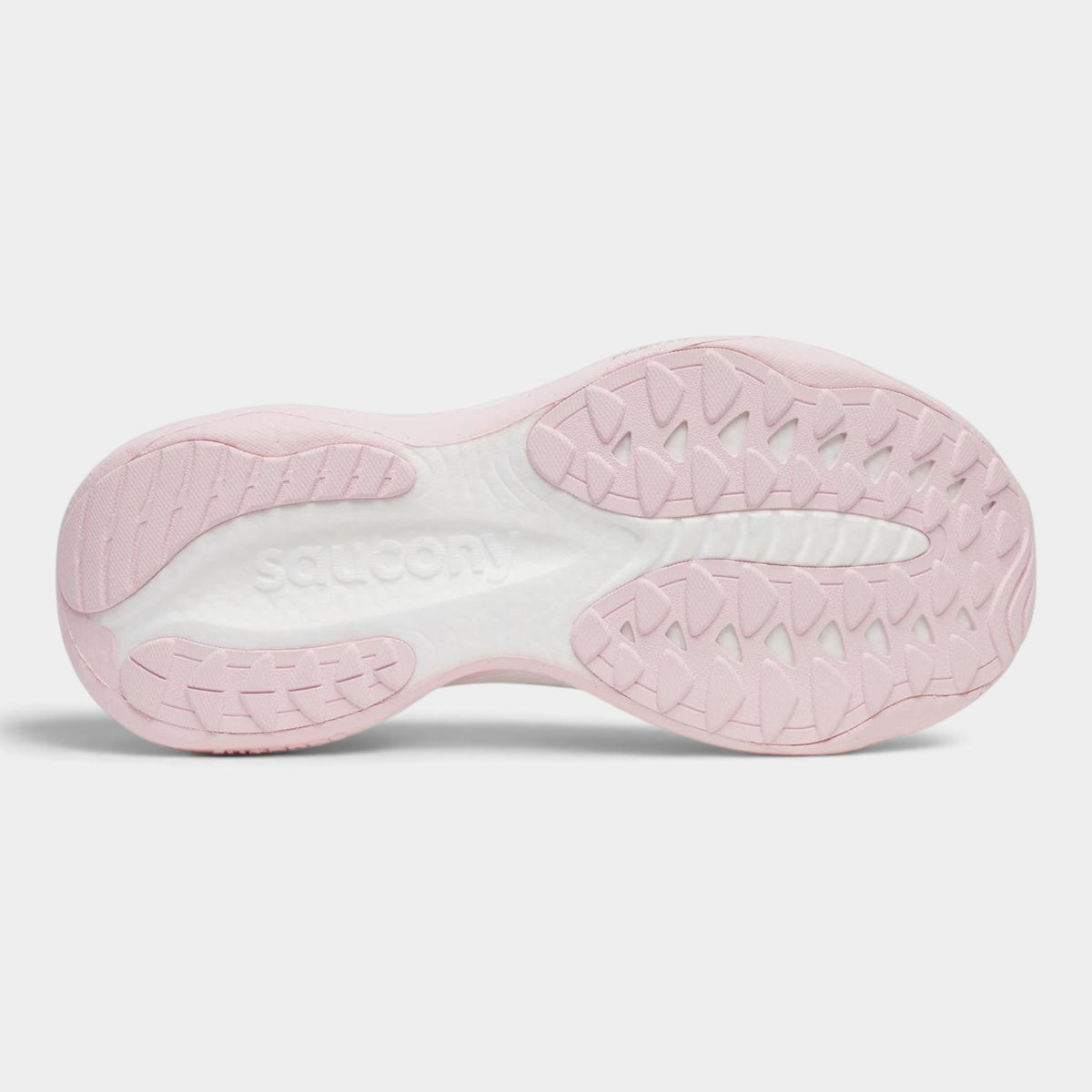 The outsole of a Saucony shoe in light pink and white, showing the textured tread pattern and the embossed Saucony brand name.