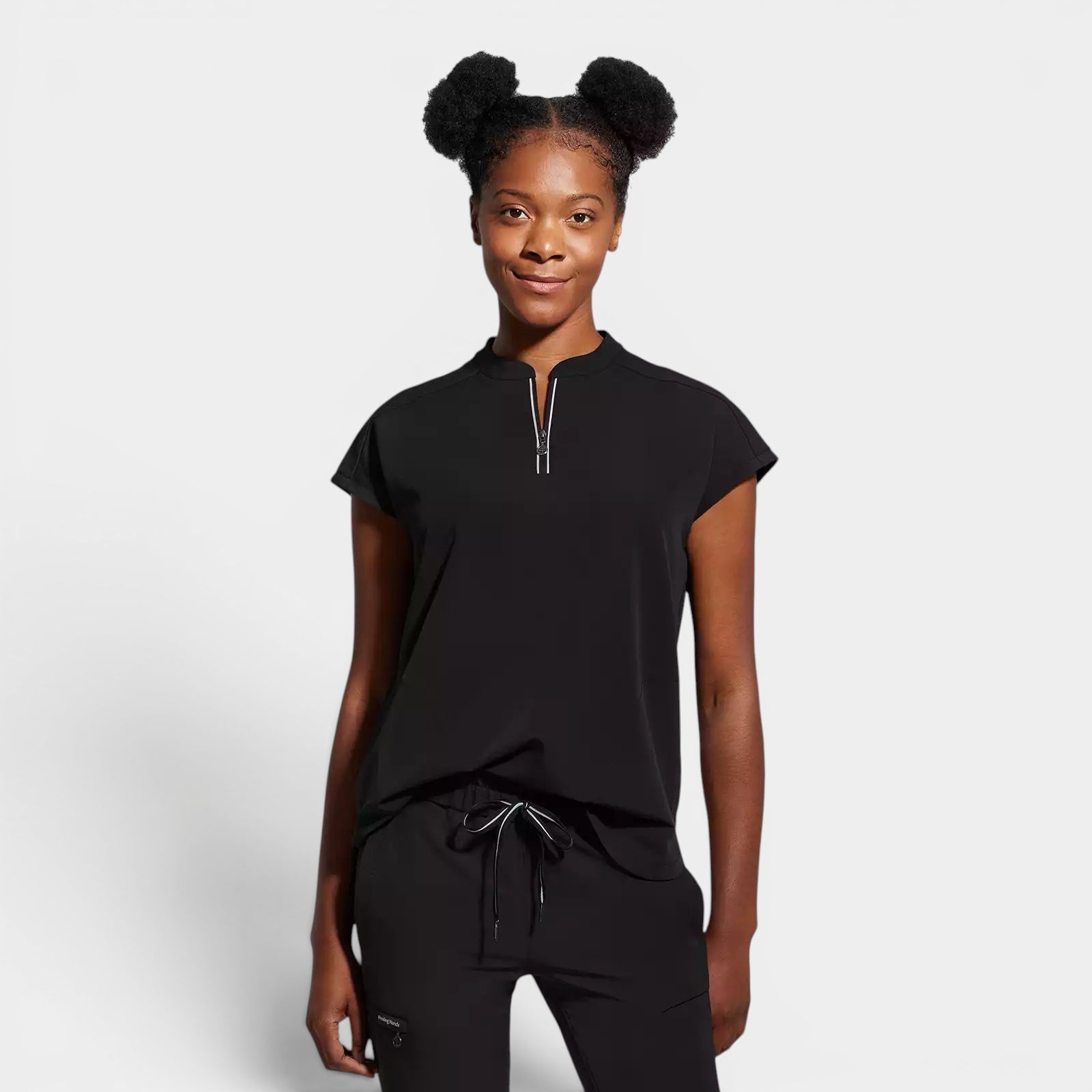 Read's Uniforms black knit scrub top with dolman sleeves, partial zip front, side vents, and rounded hem.