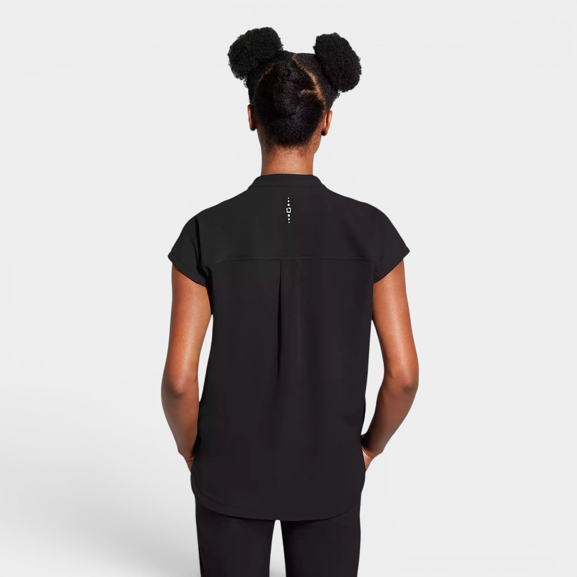 Read's Uniforms black relaxed fit dolman sleeve top with side vents and rounded hem. Features knit details and a partial zip front.