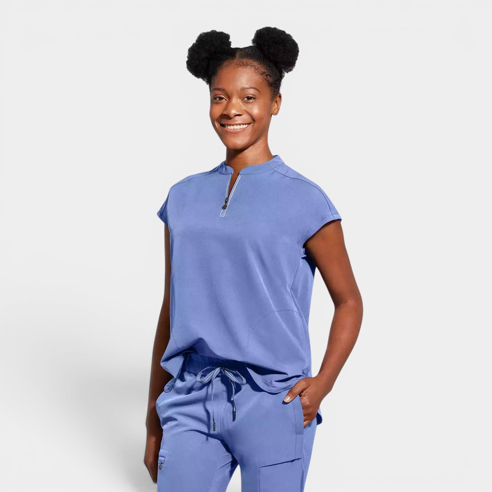 Read's Uniforms blue relaxed fit dolman sleeve scrub top with partial zip front and rounded hem.