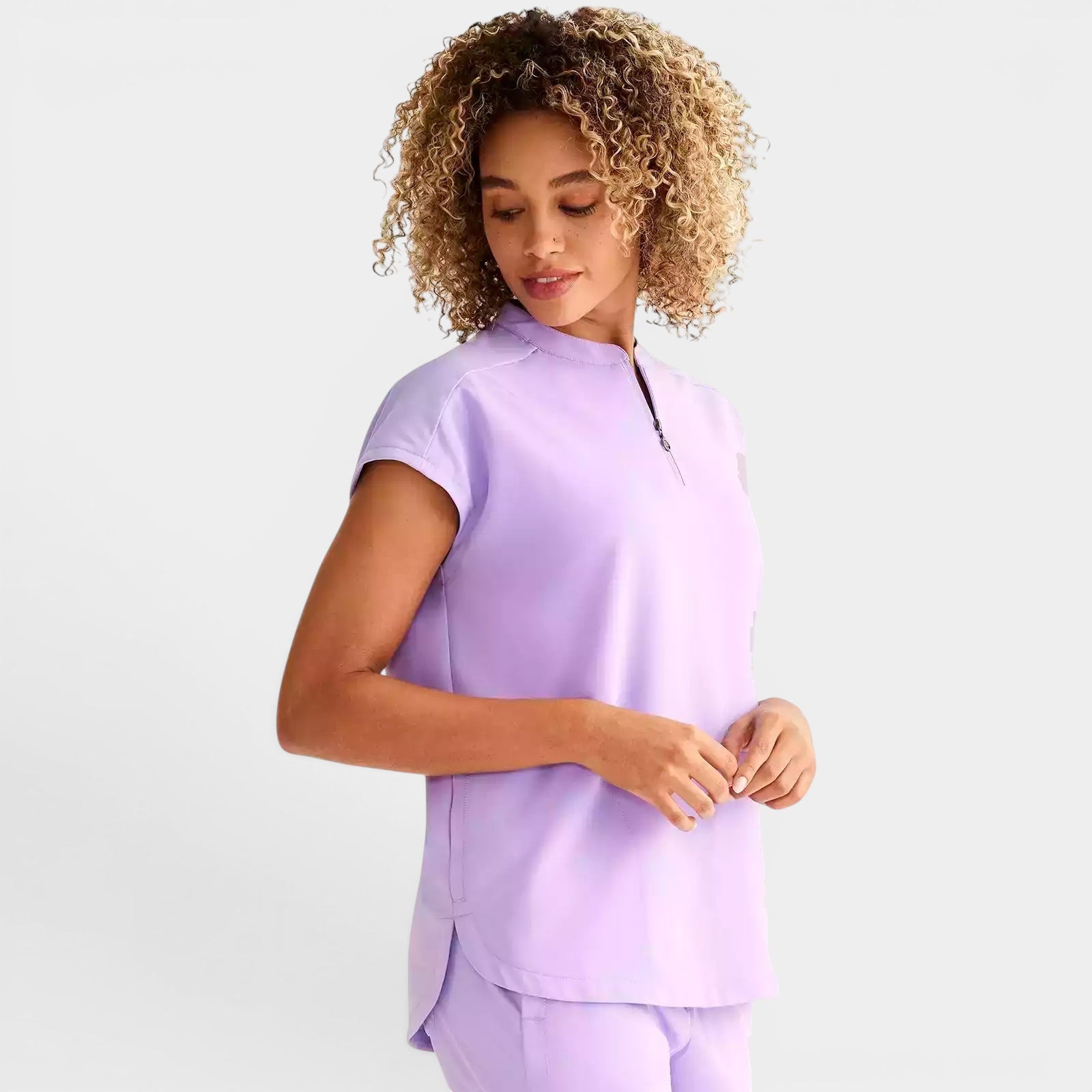 Read's Uniforms light purple relaxed fit dolman sleeve scrub top with partial zip front and rounded hem.