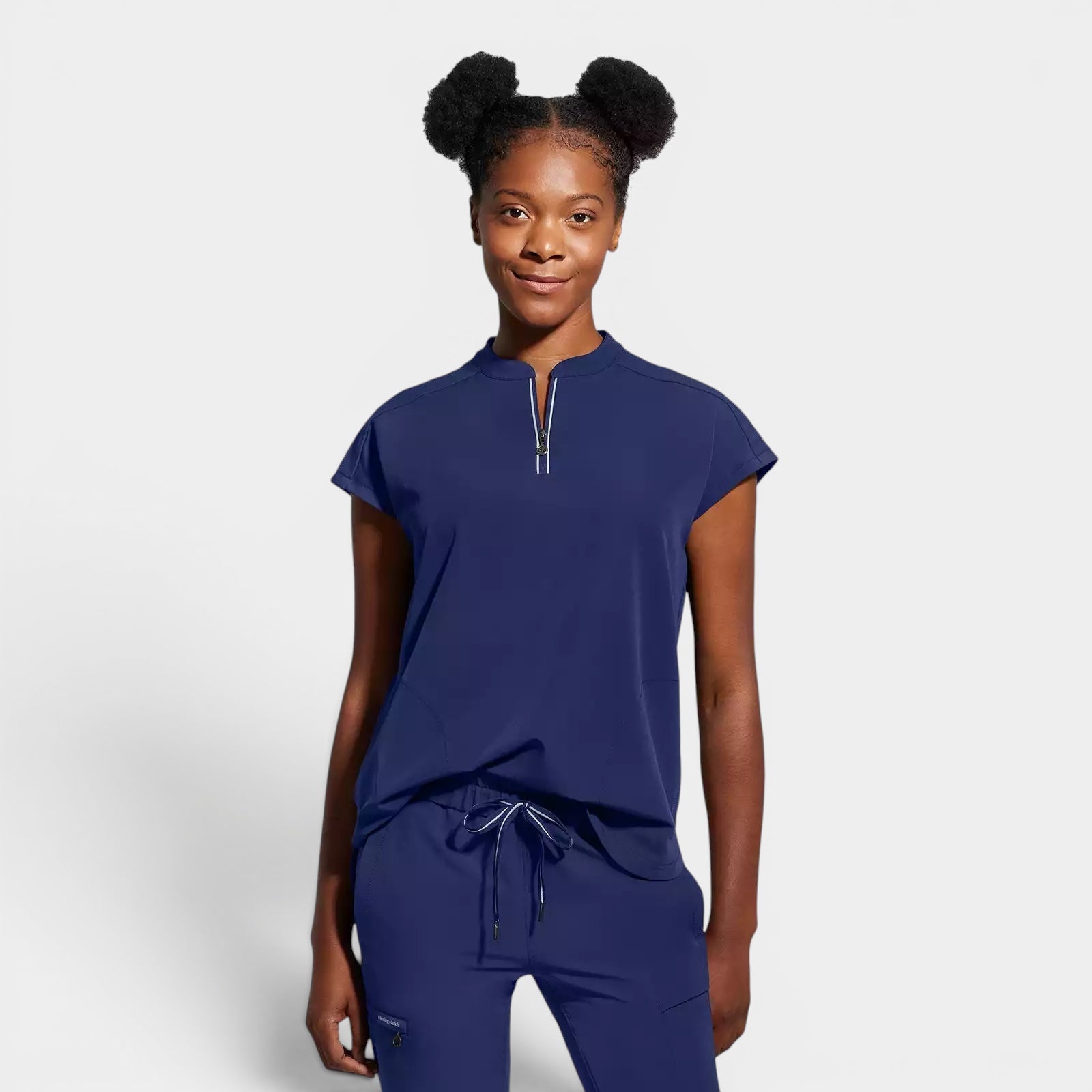 Read's Uniforms navy blue relaxed fit scrub top with dolman sleeves, partial zip front, and rounded hem.