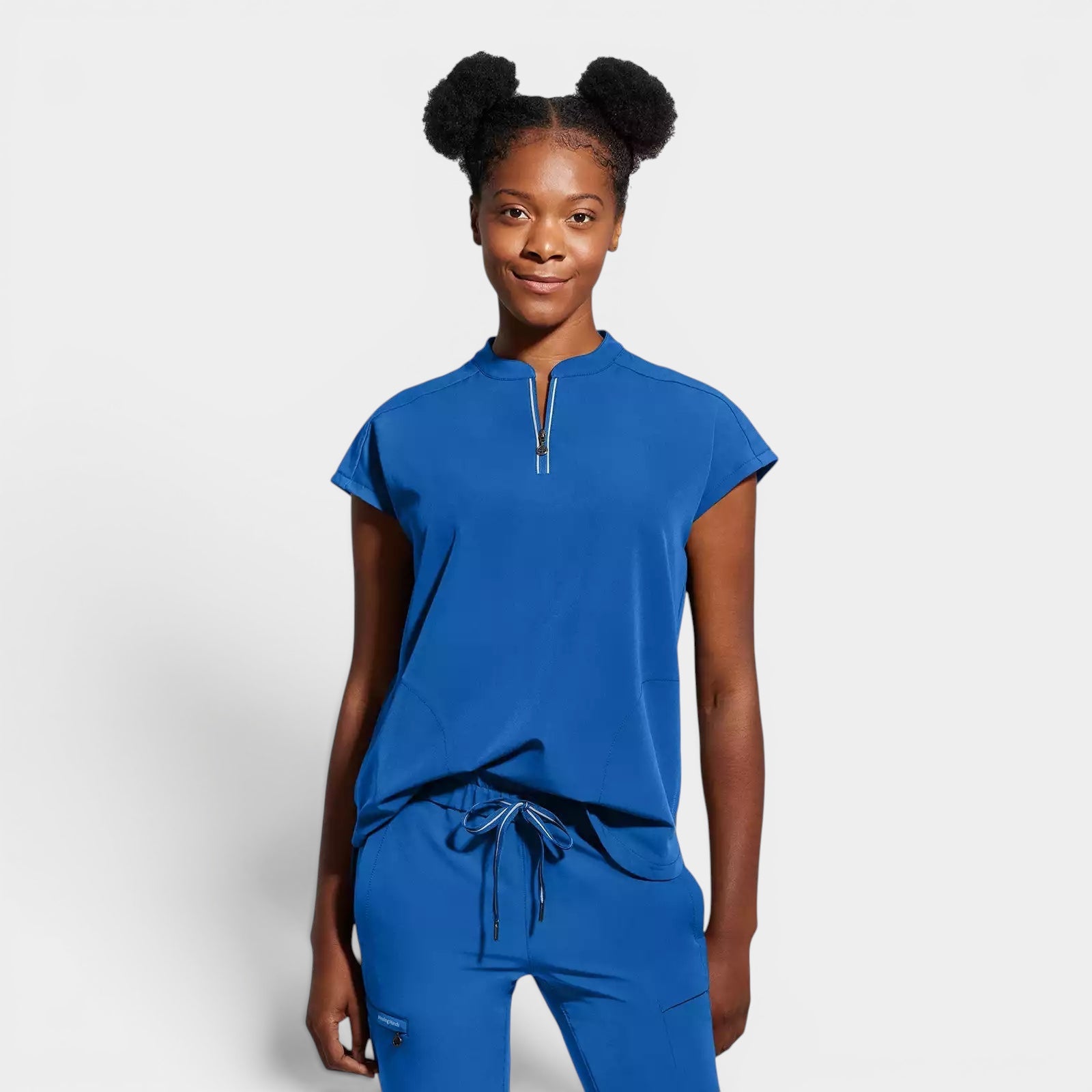 Read's Uniforms royal blue knit scrub top with dolman sleeves, side vents, and partial zip front.
