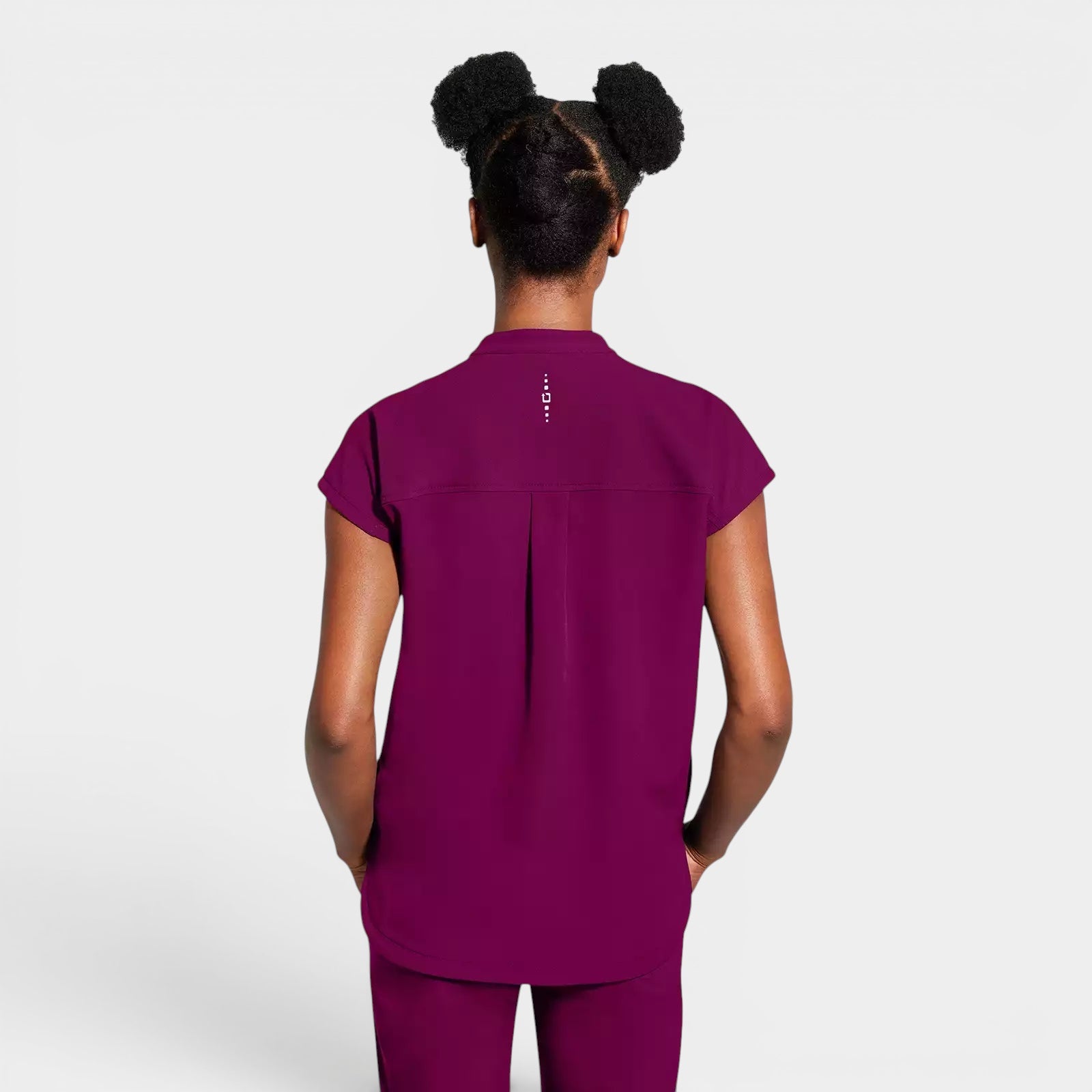 Read's Uniforms plum purple relaxed fit dolman sleeve scrub top with partial zip front and rounded hem.