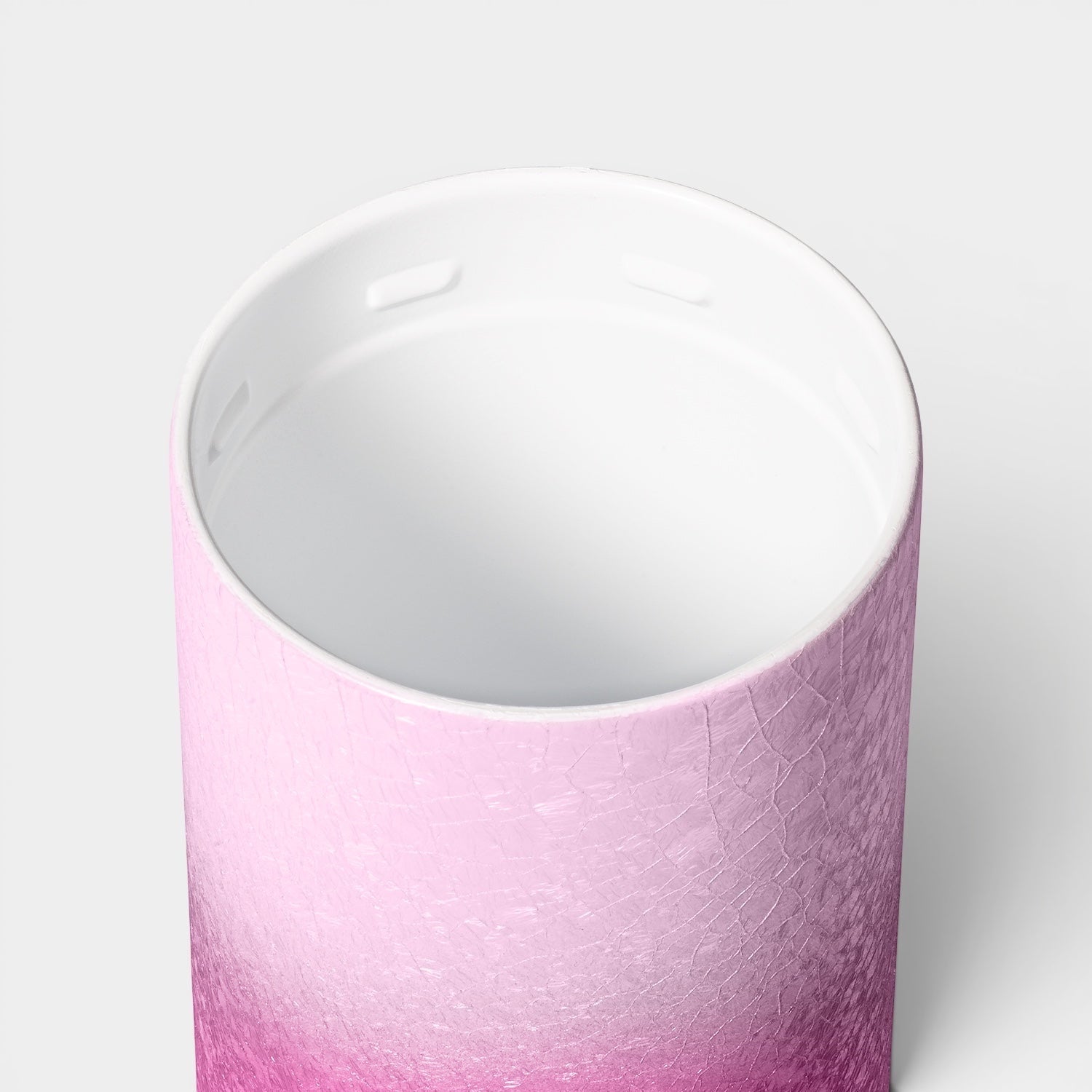 Read's Uniforms Brumate Strova 18oz tumbler showing the white ceramic-lined interior and pink textured exterior.
