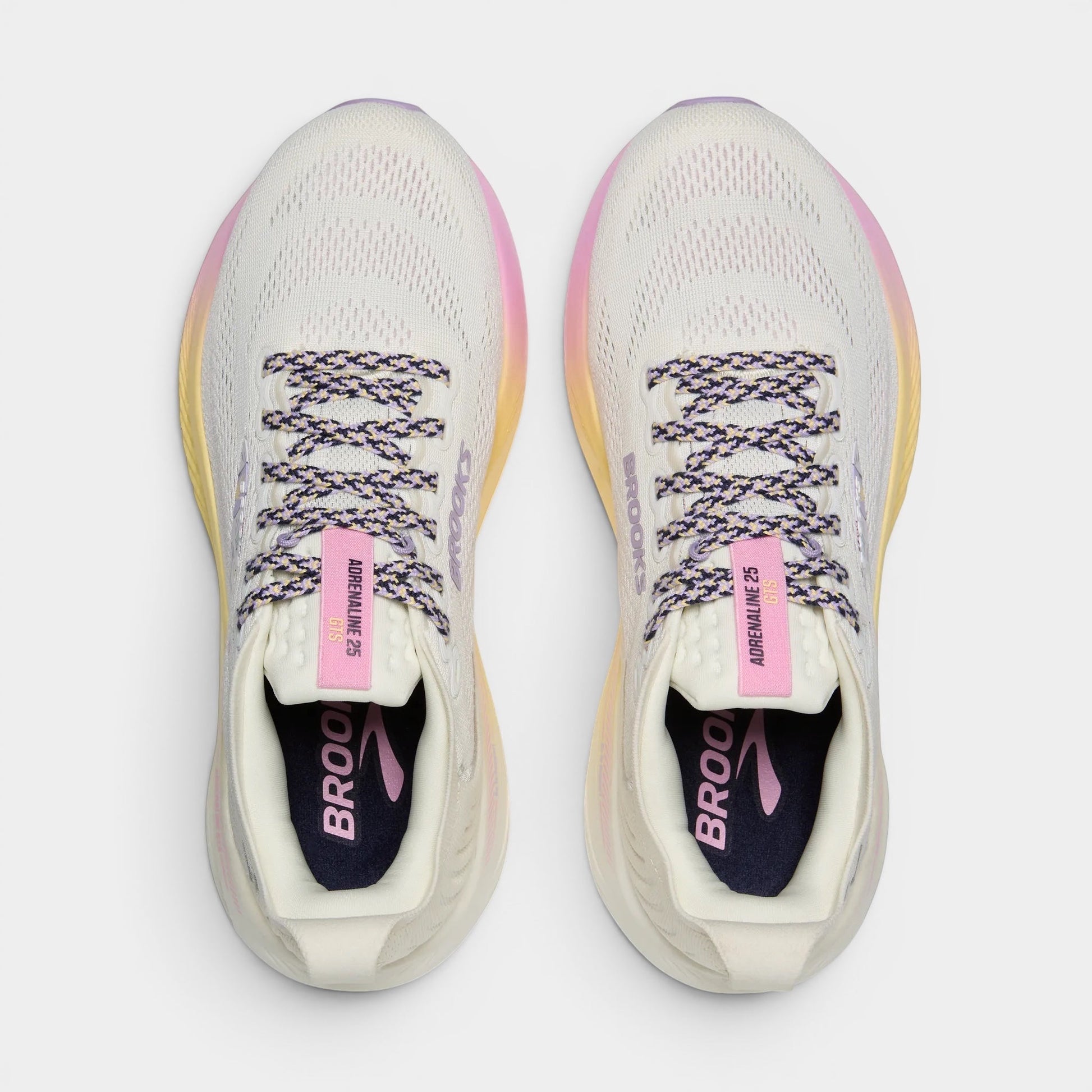 Read's Uniforms Adrenaline GTS 25 women's running shoes in cream with purple and pink gradient sole. Features breathable mesh upper and patterned laces.