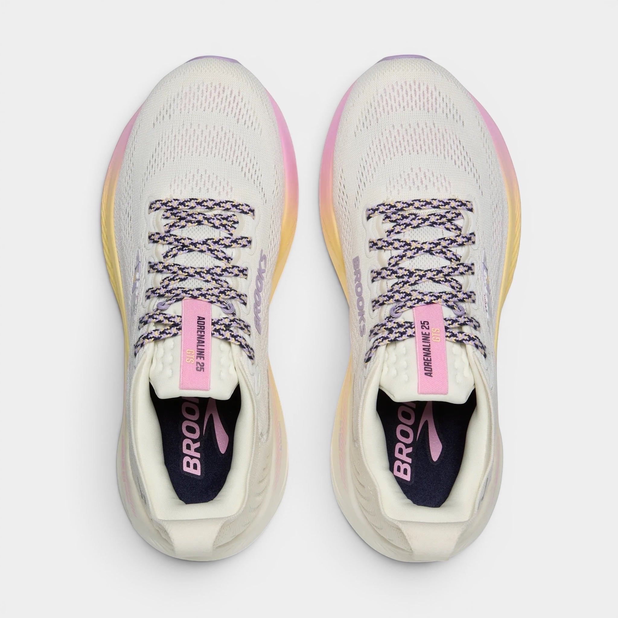 Read's Uniforms Adrenaline GTS 25 women's running shoes in cream with purple and pink gradient sole. Features breathable mesh upper and patterned laces.