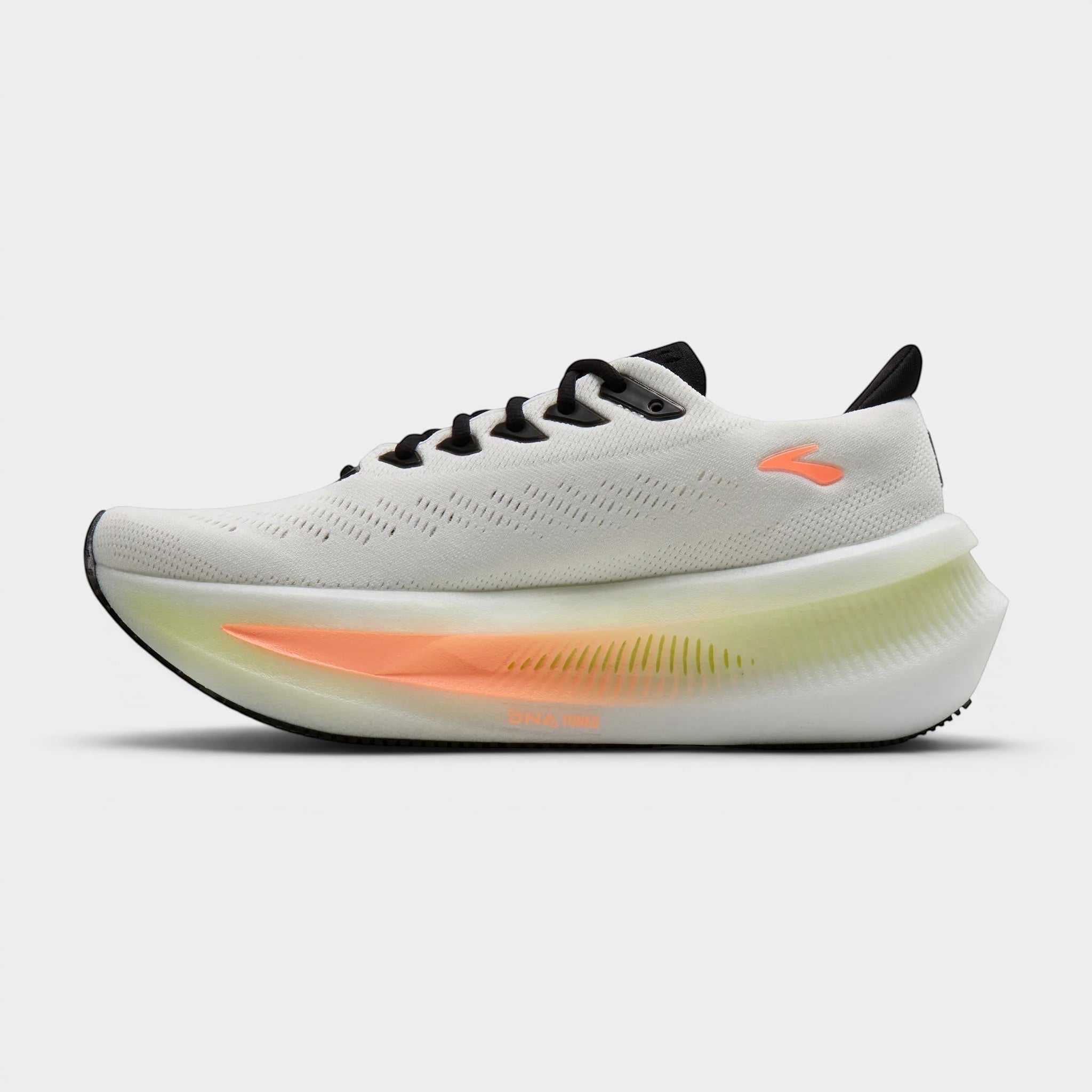 Read's Uniforms white and cream women's running shoe with orange and yellow accents on the sole. Features a breathable mesh upper and maximum cushioning.