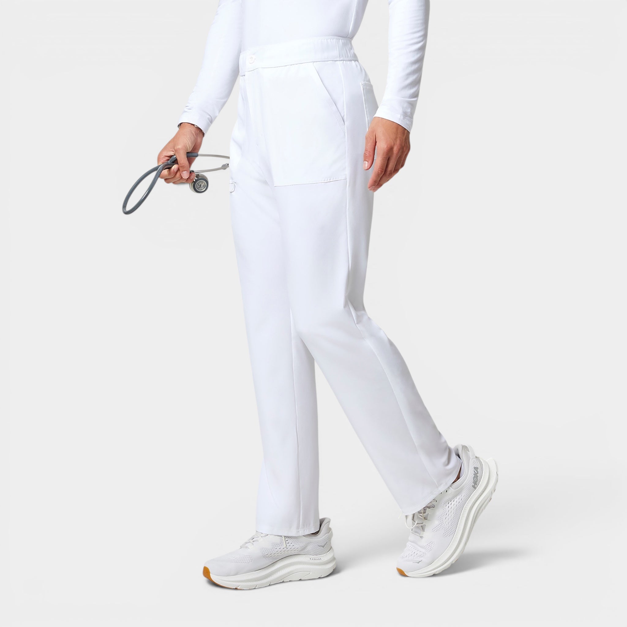 Read's Uniforms white polyester-blend cargo pants with a straight leg, back elastic waistband, and 5 pockets. Model holds a stethoscope.